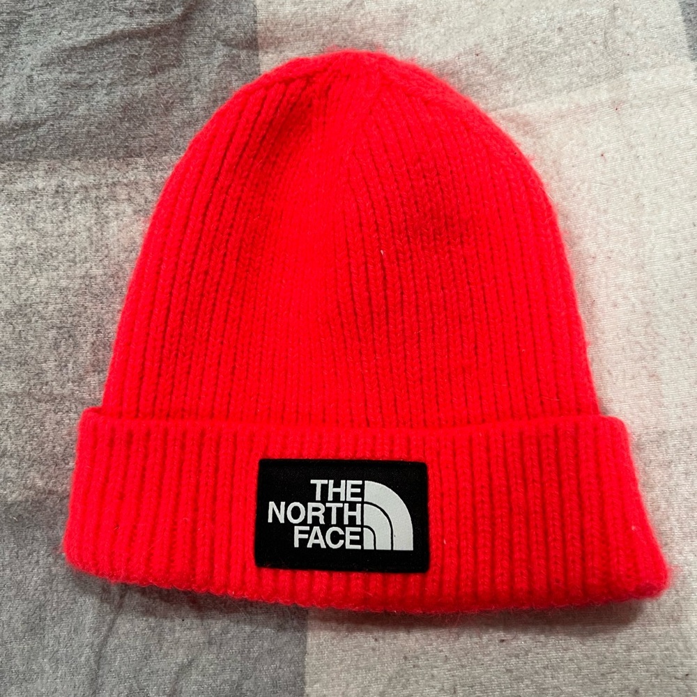 Kids North Face hat, bright salmon color, good for teens.
